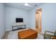 Comfortable sitting area with a TV and armchair at 17953 Grand Prosperity Dr, Venice, FL 34293