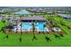 A waterfront community with a spacious clubhouse, community pool, tennis courts, and ample green space at 18861 Bianchi St, Venice, FL 34293