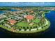 Beautiful aerial shot of a lakefront community featuring well-manicured lawns and resort-style amenities at 18861 Bianchi St, Venice, FL 34293