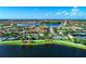 Expansive aerial view showcasing a beautiful community surrounded by scenic lakes and lush green spaces at 18861 Bianchi St, Venice, FL 34293