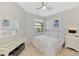 Comfortable bedroom with a ceiling fan, carpet flooring, closet, and beach themed decor at 18861 Bianchi St, Venice, FL 34293