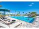 A large community pool with plenty of room for swimming and lounge chairs for sunbathing at 18861 Bianchi St, Venice, FL 34293