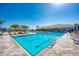 Large community pool with sunshades and plenty of lounge seating at 18861 Bianchi St, Venice, FL 34293
