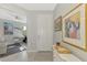 Welcoming foyer featuring tile flooring, decorative artwork, and views into the living spaces at 18861 Bianchi St, Venice, FL 34293