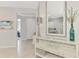 Bright entryway with decorative console table, large mirror, and views into adjacent living spaces at 18861 Bianchi St, Venice, FL 34293