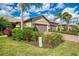 Charming single-story home featuring a two-car garage, well-manicured landscaping, and a paver driveway at 18861 Bianchi St, Venice, FL 34293