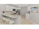 Kitchen with stainless steel appliances, white cabinetry, and granite countertops at 18861 Bianchi St, Venice, FL 34293