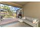 Comfortable covered lanai showcases outdoor seating, table, and view of backyard at 18861 Bianchi St, Venice, FL 34293