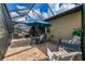 This covered lanai features an outdoor dining area and seating area at 18861 Bianchi St, Venice, FL 34293