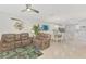 Open-concept living room flows into the dining area, creating a great space for entertaining at 18861 Bianchi St, Venice, FL 34293