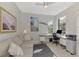 Bright home office featuring a comfortable seating area, built-in desk, and ample natural light at 18861 Bianchi St, Venice, FL 34293