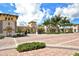 A beautiful gated community entrance with lush landscaping and brick roads at 20590 Granlago Dr, Venice, FL 34293