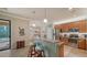 Bright kitchen featuring granite counters, pendant lighting, and stainless steel appliances at 20590 Granlago Dr, Venice, FL 34293