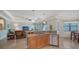 Modern kitchen with stainless steel dishwasher, granite counters, open to living area at 20590 Granlago Dr, Venice, FL 34293