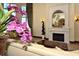 Elegant living room features a fireplace, mantel, and sophisticated decor creating an inviting space at 20590 Granlago Dr, Venice, FL 34293