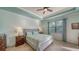 Calming main bedroom featuring tray ceilings, large windows, and stylish decor at 20590 Granlago Dr, Venice, FL 34293