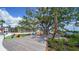 Inviting outdoor space featuring comfortable seating and lush landscaping for relaxation and enjoyment at 20590 Granlago Dr, Venice, FL 34293