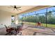 Outdoor patio with screened enclosure, nice table and chairs and outdoor grill at 20590 Granlago Dr, Venice, FL 34293