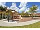 Community playground with slides, swings, and a covered bench at 20590 Granlago Dr, Venice, FL 34293