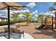 Inviting community playground featuring slides, seesaw, and a covered bench at 20590 Granlago Dr, Venice, FL 34293