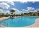 Inviting community pool with clear blue water and lounge seating offers the perfect spot at 20590 Granlago Dr, Venice, FL 34293