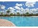 Beautiful community pool, with clear blue water and ample lounge seating for residents at 20590 Granlago Dr, Venice, FL 34293