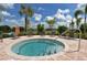 Inviting community spa featuring crystal clear water, lounge chairs, and lush landscaping at 20590 Granlago Dr, Venice, FL 34293