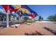 Town center public space with colorful shade structure and modern seating at 20590 Granlago Dr, Venice, FL 34293