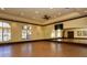 Community yoga room with large windows and mirrored wall at 20590 Granlago Dr, Venice, FL 34293