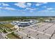 Aerial view of a baseball stadium with ample parking and surrounding landscape at 23499 Awabuki Dr # 102, Venice, FL 34293