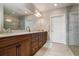 Elegant bathroom with double vanity, large shower, and ample storage at 23499 Awabuki Dr # 102, Venice, FL 34293