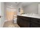 Clean bathroom with single vanity and shower/tub combo at 23499 Awabuki Dr # 102, Venice, FL 34293