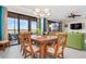 Formal dining area with a large table and lake view at 23499 Awabuki Dr # 102, Venice, FL 34293
