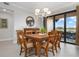 Elegant dining room with chandelier and lake view at 23499 Awabuki Dr # 102, Venice, FL 34293