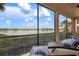 Serene lanai with lake view, perfect for lounging at 23499 Awabuki Dr # 102, Venice, FL 34293