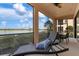 Covered lanai offers scenic lake views and seating at 23499 Awabuki Dr # 102, Venice, FL 34293