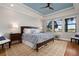 Spacious main bedroom with wood flooring and large windows at 23499 Awabuki Dr # 102, Venice, FL 34293