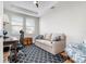 Bright office with a desk, chair, and comfortable couch at 23499 Awabuki Dr # 102, Venice, FL 34293