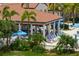 Relaxing pool bar area with tables and chairs at 23499 Awabuki Dr # 102, Venice, FL 34293