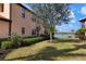 Landscaped yard with lake view at 23499 Awabuki Dr # 102, Venice, FL 34293