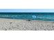 Relaxing beach scene with ocean waves and beachgoers at 237 Venice East Blvd, Venice, FL 34293
