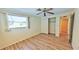 Bedroom with ceiling fan, wood-look floors and sliding door closet at 237 Venice East Blvd, Venice, FL 34293