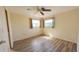 Bright bedroom featuring laminate wood flooring and ample natural light at 237 Venice East Blvd, Venice, FL 34293