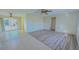 Open living area with tile and laminate wood flooring, showing access to other rooms at 237 Venice East Blvd, Venice, FL 34293