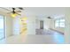 Spacious living room with tile and wood flooring, and a view into the kitchen at 237 Venice East Blvd, Venice, FL 34293
