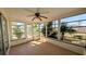 Bright sunroom with screened windows offering backyard views at 237 Venice East Blvd, Venice, FL 34293