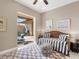 Guest bedroom with daybed and access to a private patio at 249 Rio Terra, Venice, FL 34285