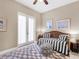 Guest bedroom with daybed and access to a private patio at 249 Rio Terra, Venice, FL 34285
