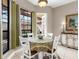 Charming breakfast nook with table and chairs, adjacent to the patio at 249 Rio Terra, Venice, FL 34285