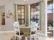Bright breakfast nook with a table and chairs, offering access to a patio at 249 Rio Terra, Venice, FL 34285